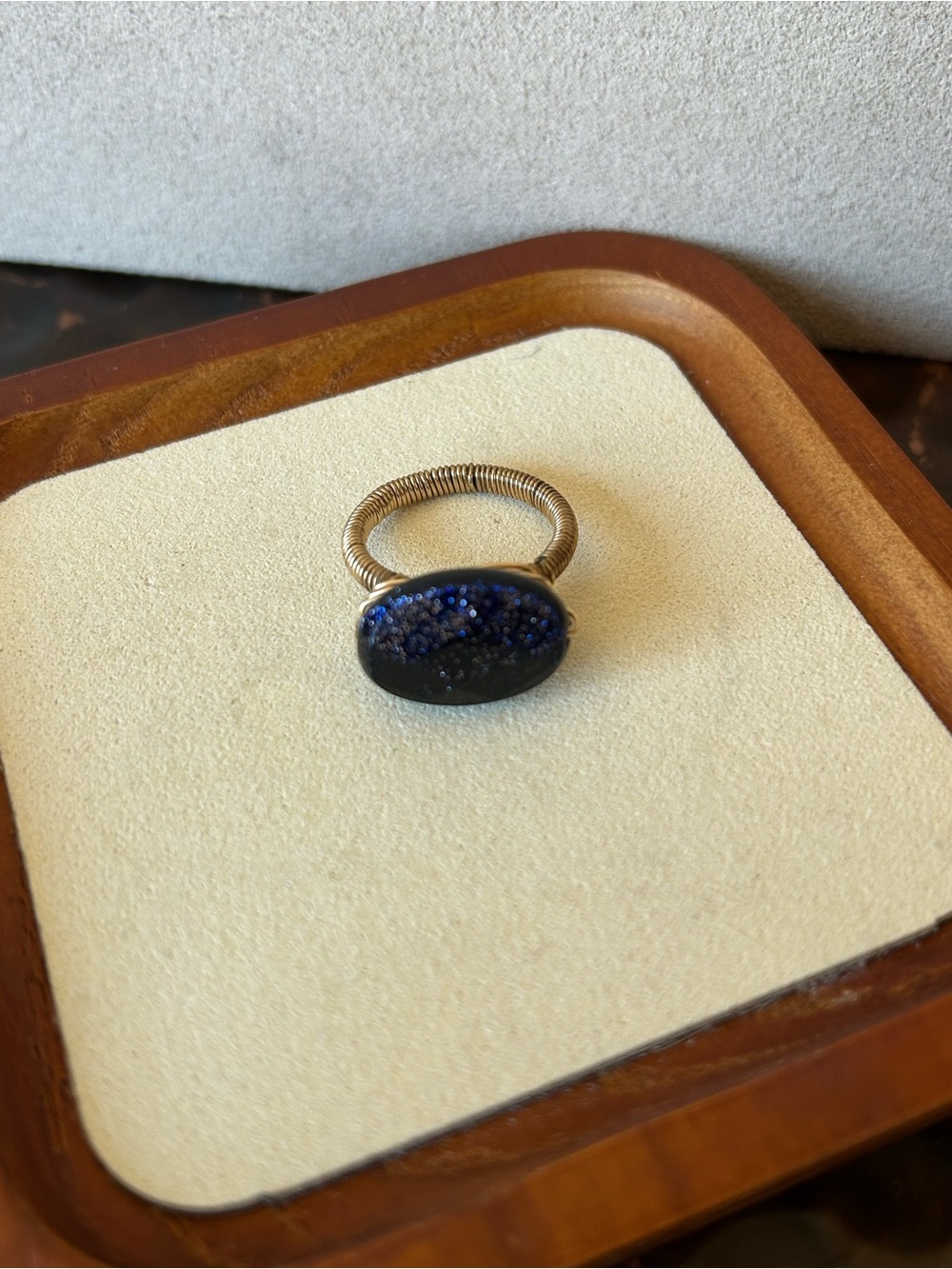 Black Faceted Stone with gold wire ring. Size 7